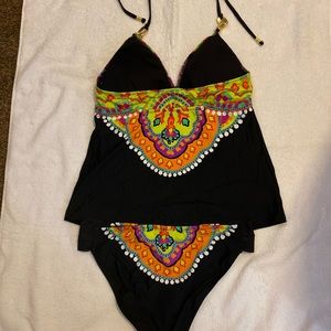 A beautiful Trina Turk bathing suit that I don’t recall wearing even once. Sz 12